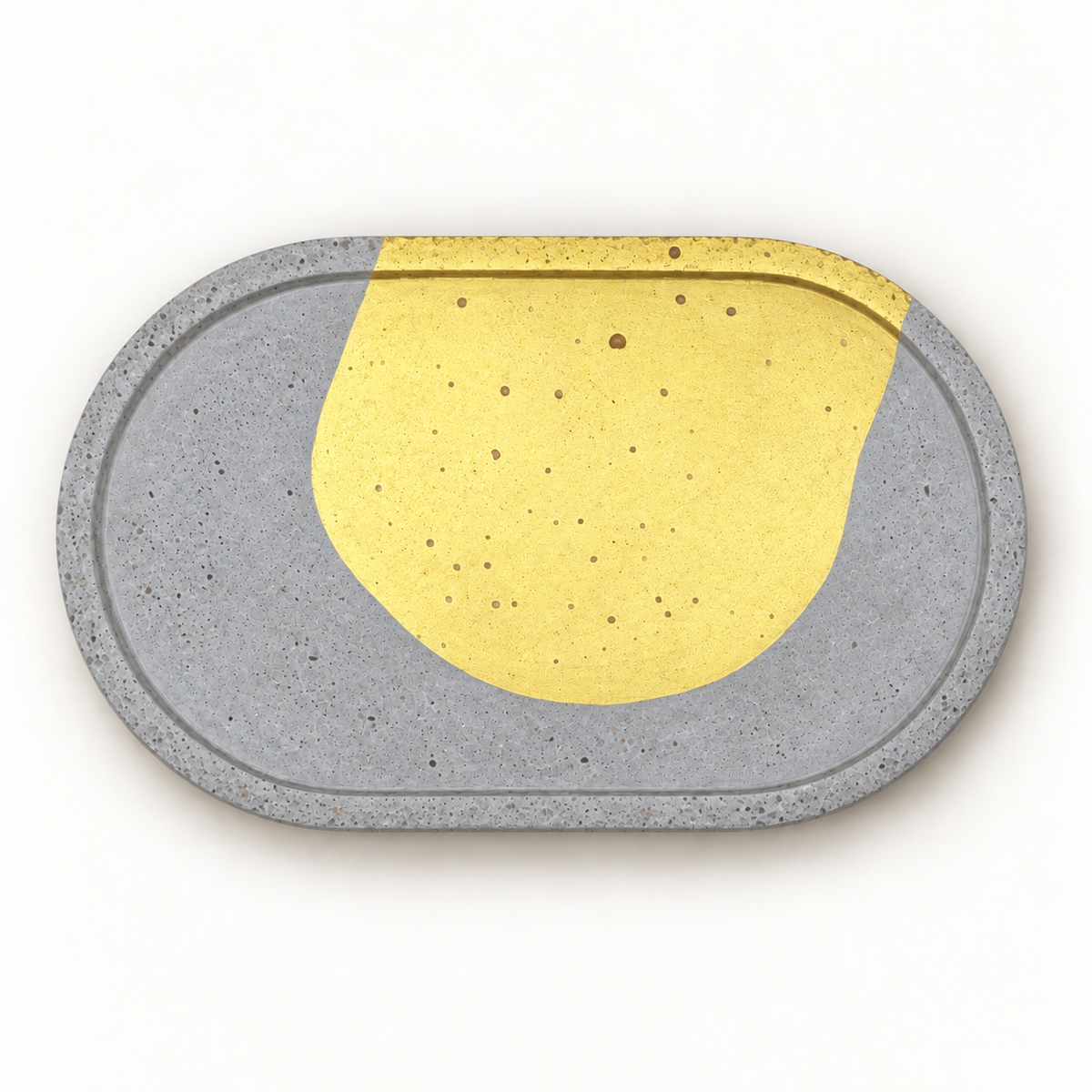 Oval concrete coaster with gold-tone arc – horizontal top view