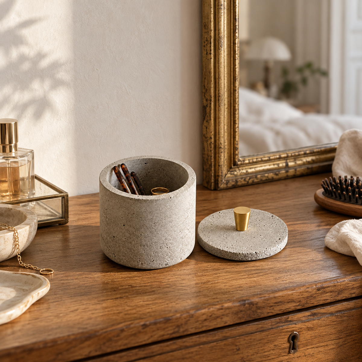 Smooth natural concrete pot on a Viennese dressing table