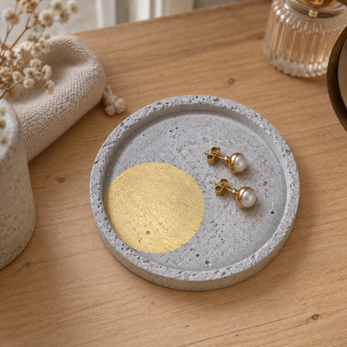 Small round concrete coaster – gold-tone circle – shown in use