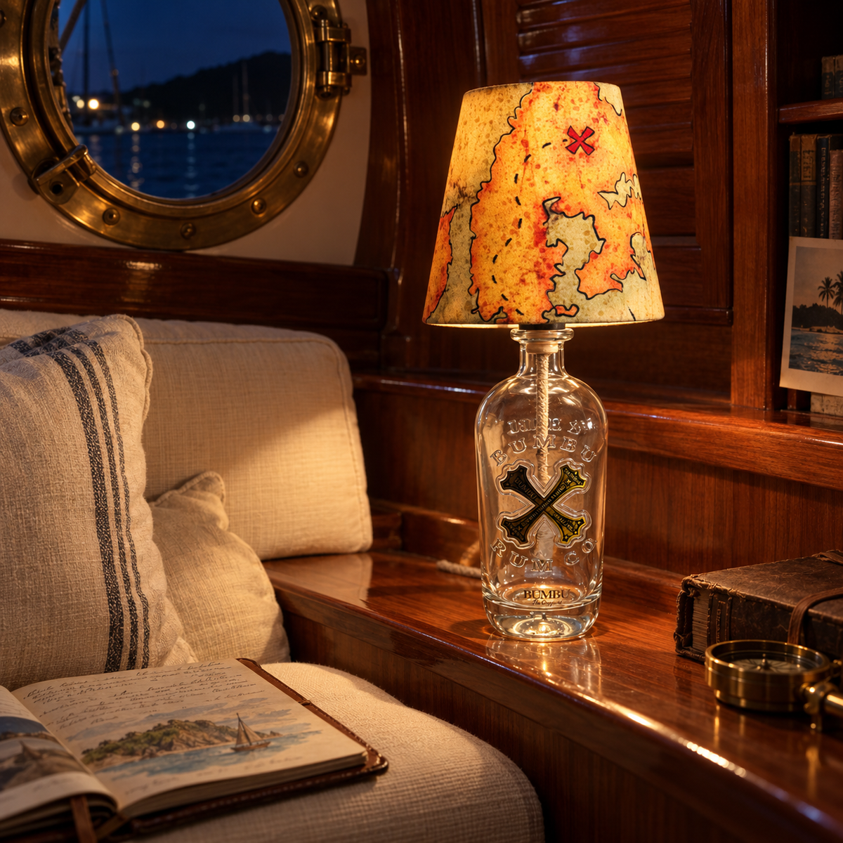 Bumbu bottle lamp switched on in a sailboat cabin at night