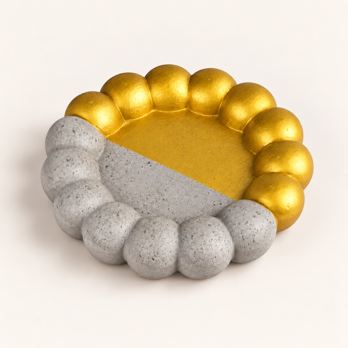 Large ribbed concrete coaster – half gold-tone – angled view