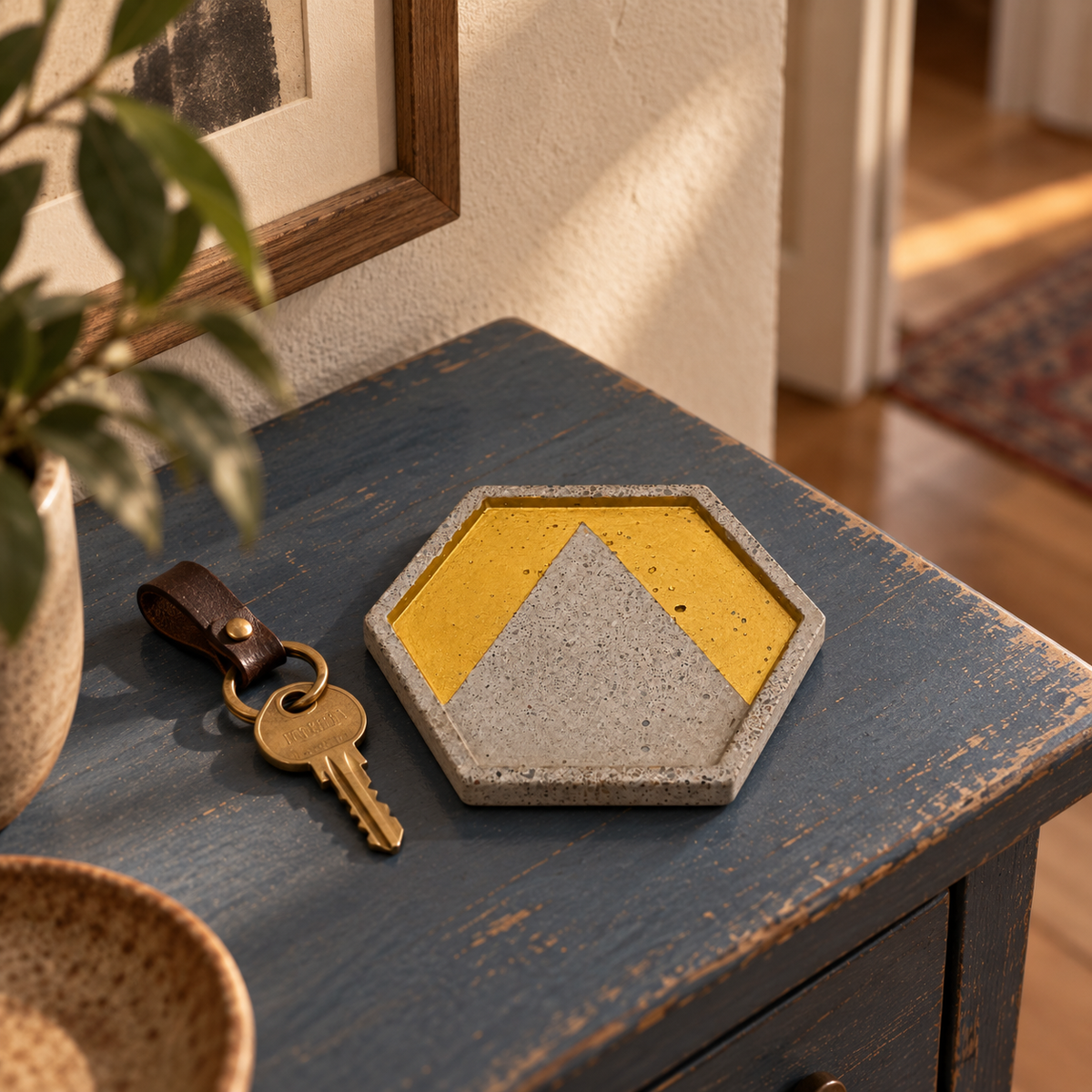 Hexagon chevron concrete coaster used as a small key tray in a Viennese period apartment