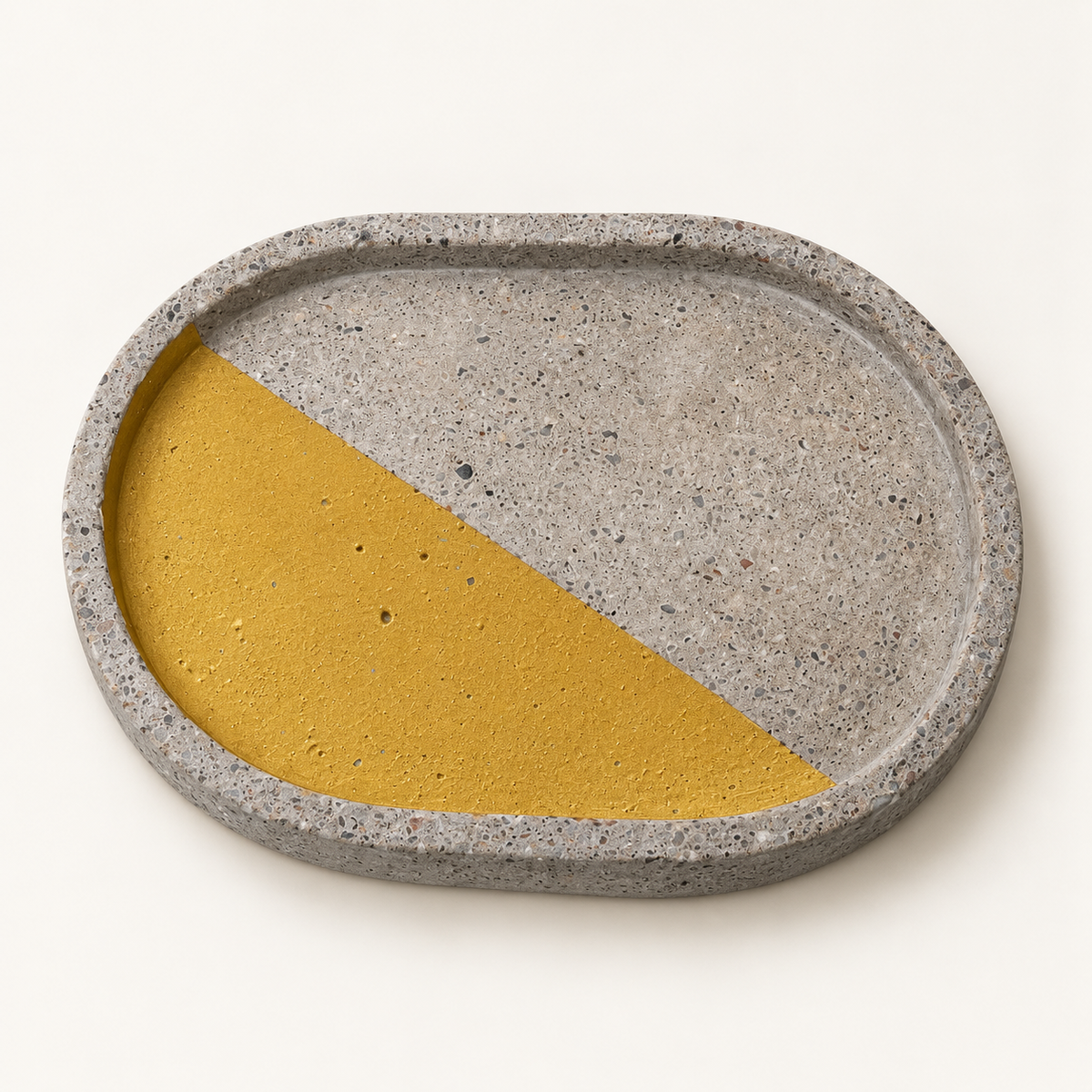 Oval concrete coaster, 15.5 × 11 cm, design 3 – studio view