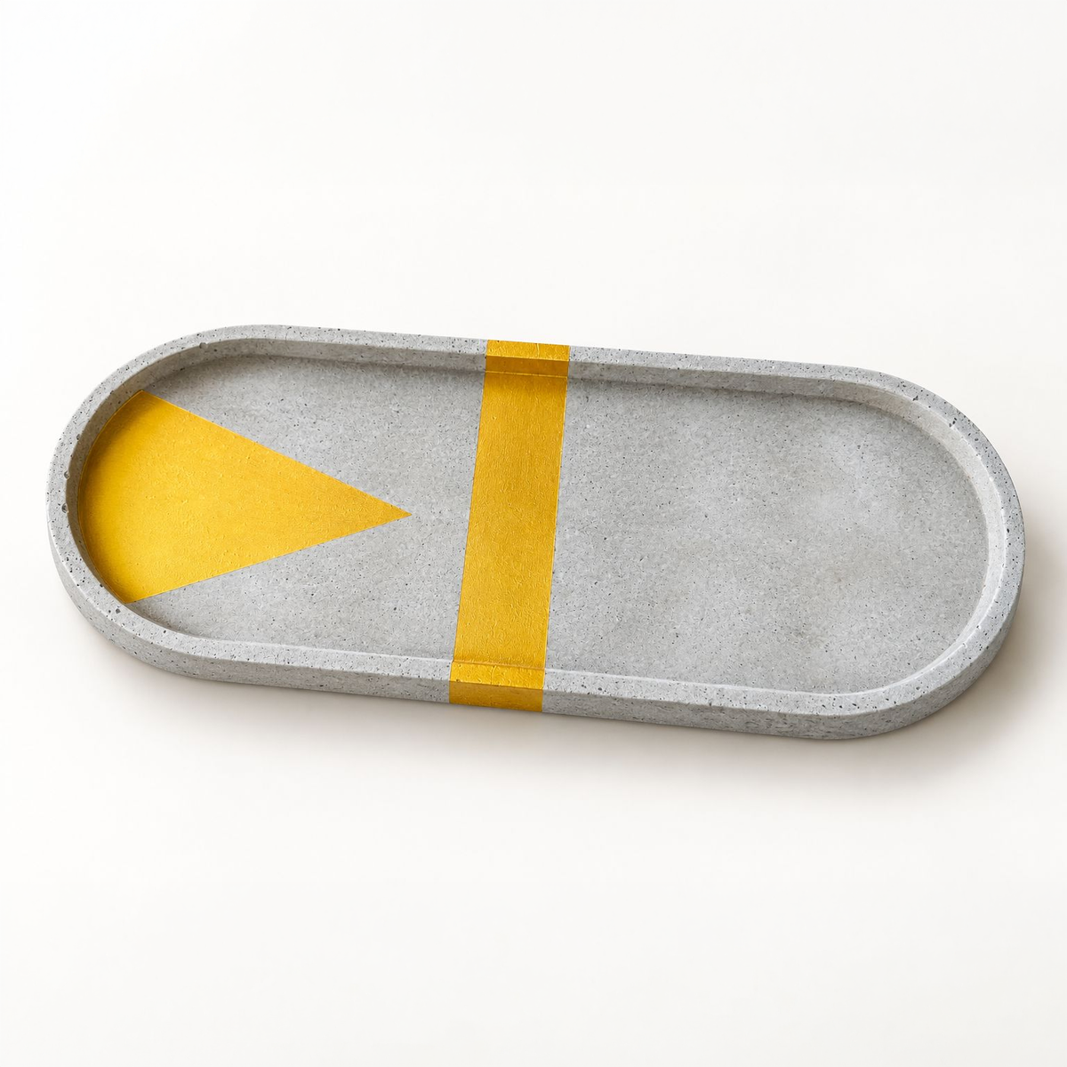 XL oval concrete coaster – gold triangle with cross stripe, full view