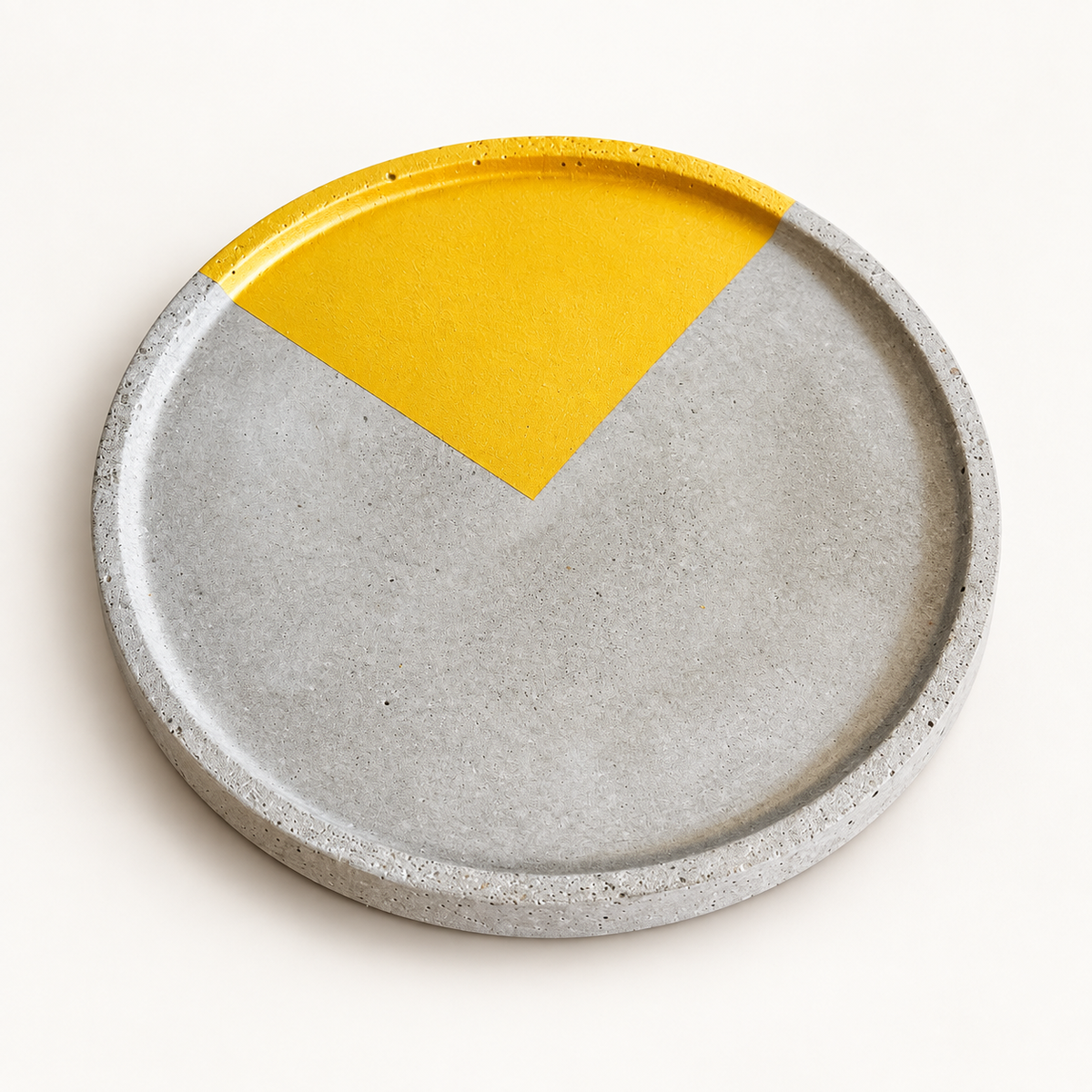 Large round concrete coaster with gold-tone circle segment
