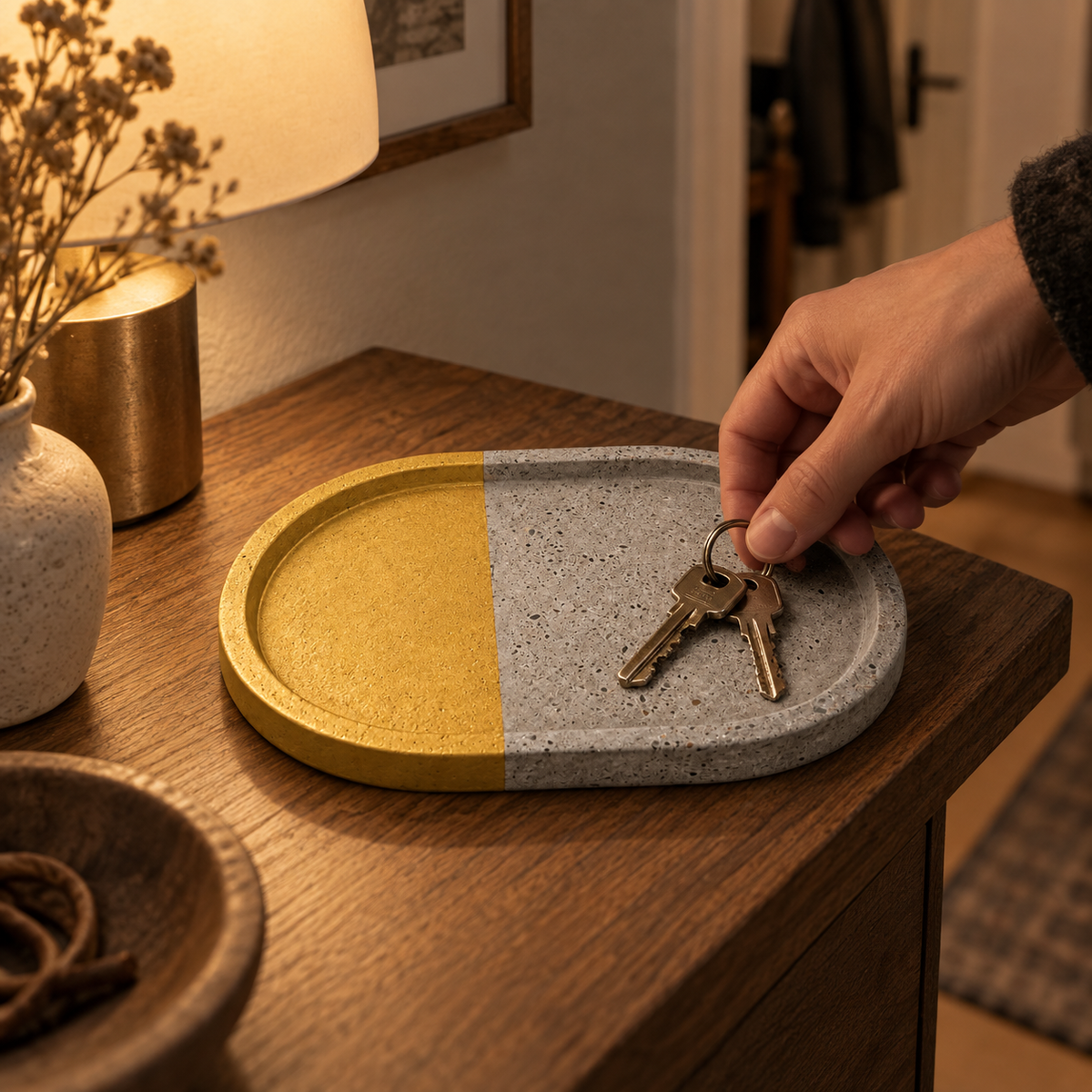 Oval concrete coaster – half gold-tone – shown in use