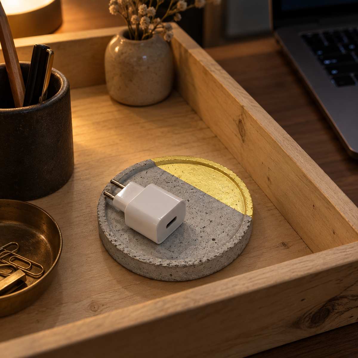 Small round concrete coaster – gold-tone arc – shown in use
