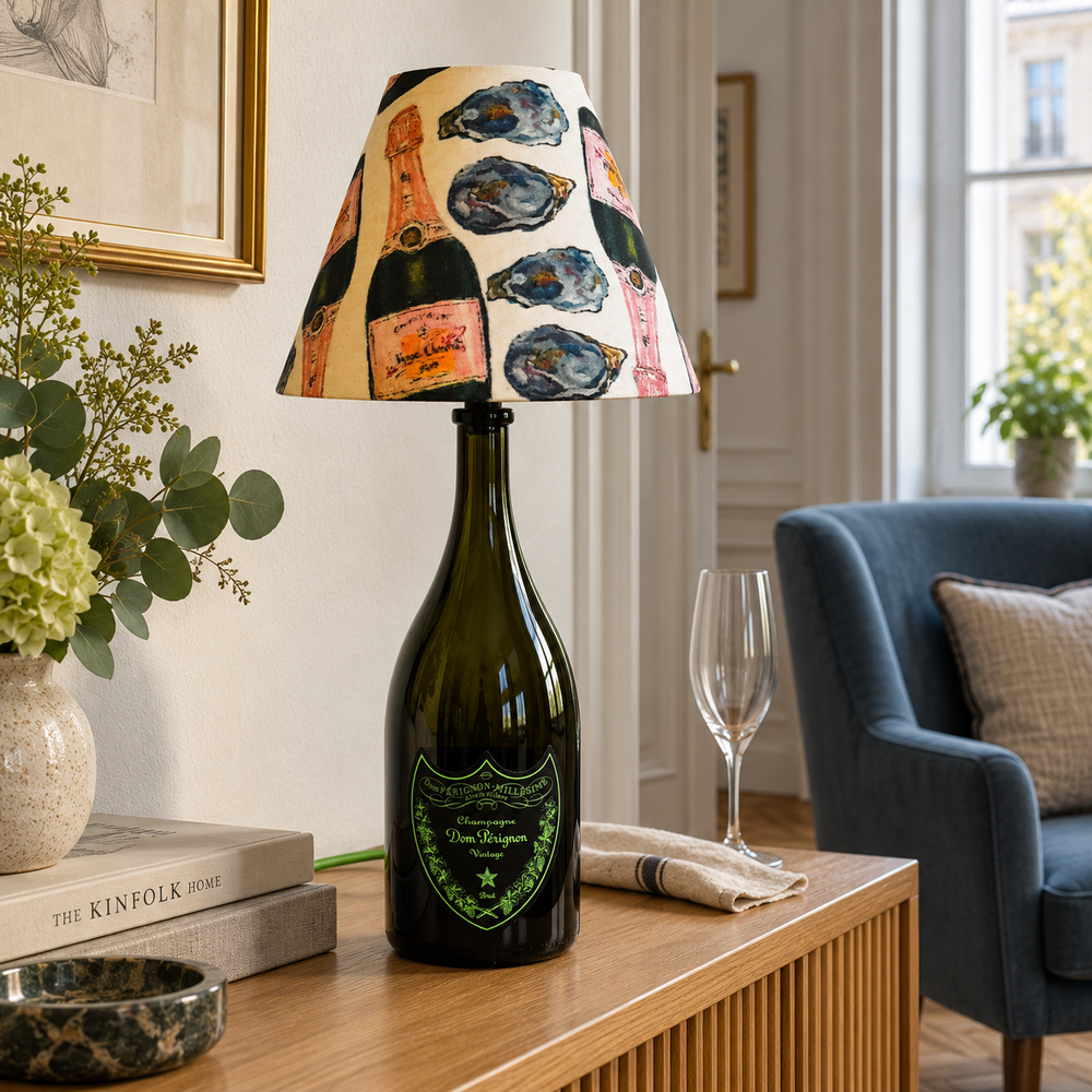 Green Dom Pérignon Vintage bottle lamp with oyster-pattern shade in a Viennese salon by day – AI-edited product image.