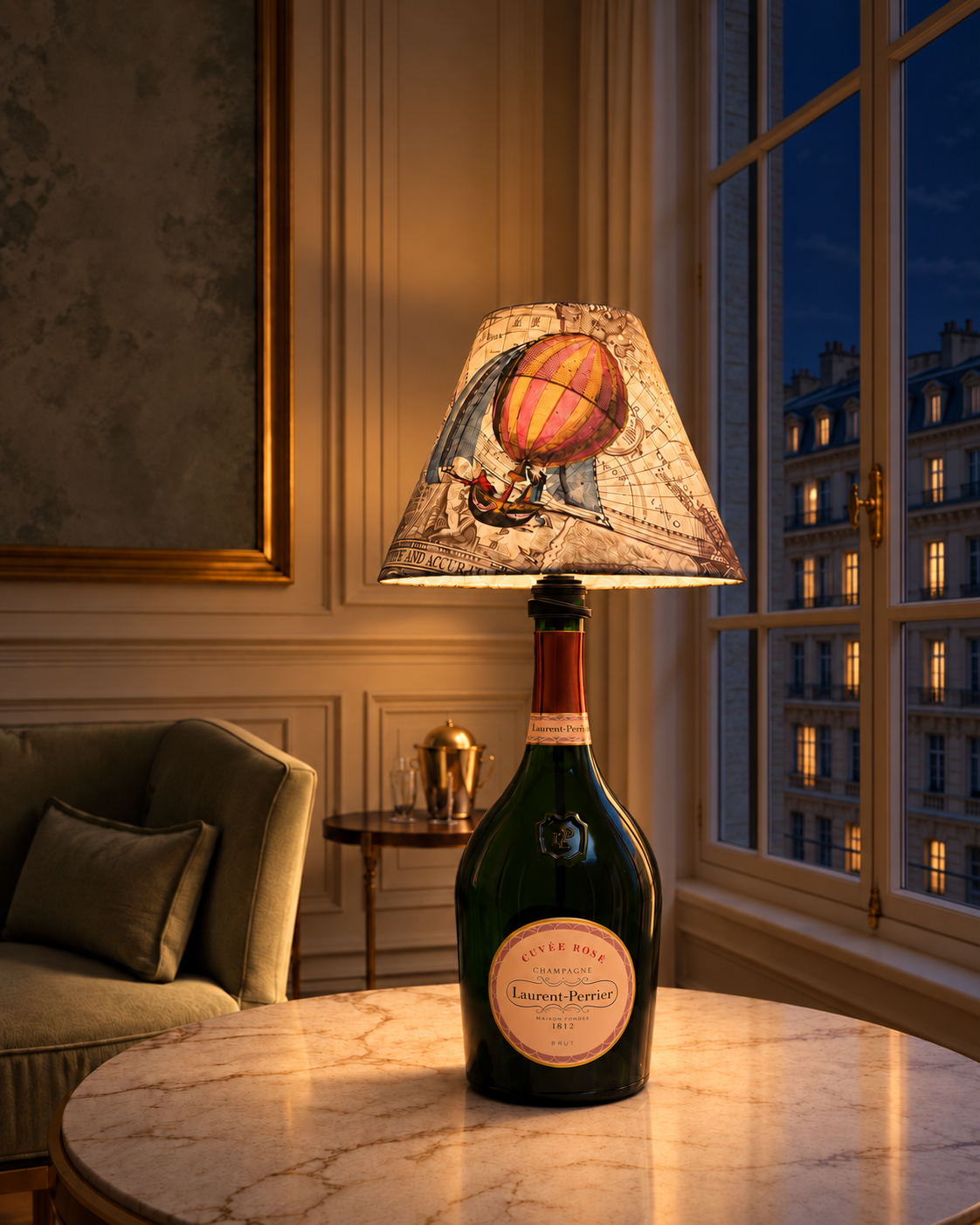 Illuminated Laurent-Perrier bottle lamp at night with lit windows opposite
