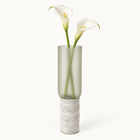 Glass-and-concrete vase – frosted, waisted base, with floral arrangement – decor not included