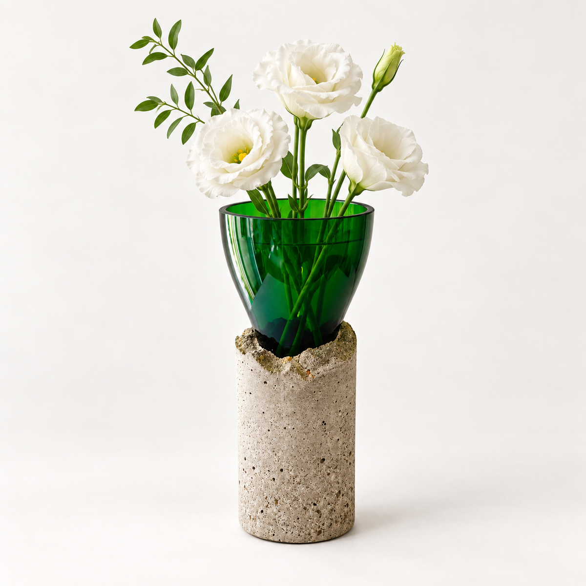 Glass-and-concrete vase – green chalice with tall base and floral arrangement – decor not included