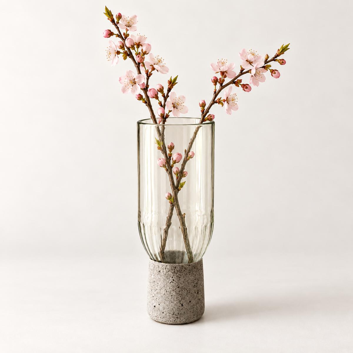 Glass-and-concrete vase – clear glass, rounded chalice shape with floral arrangement – decor not included